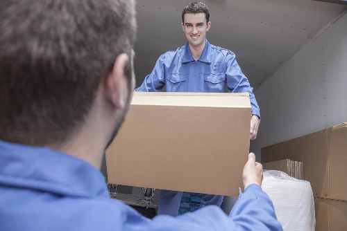 Professional movers handling packed boxes in Croydon