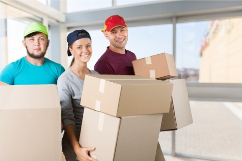 Experienced moving team packing household items