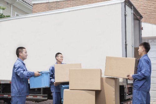 Professional movers packing a home