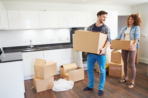 Sam Movers team packing household items