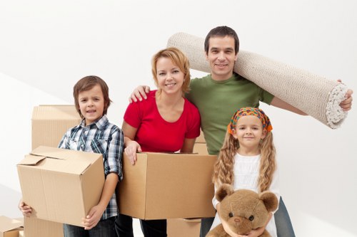 Movers carefully packing items for relocation