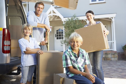 Movers safely loading items into a truck in Robertson